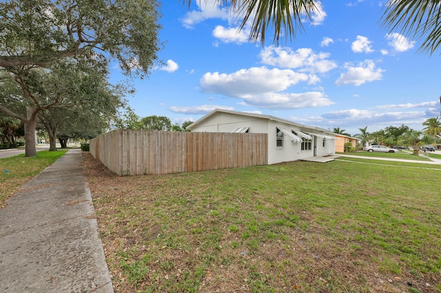 view of home's exterior with a lawn