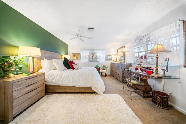 bedroom featuring ceiling fan, light colored carpet, and multiple windows