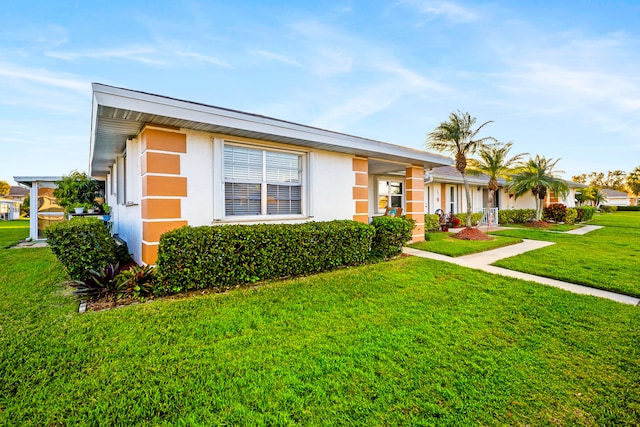 single story home featuring a front yard