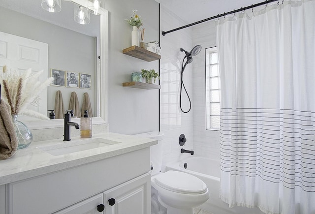 full bathroom with vanity, toilet, and shower / tub combo