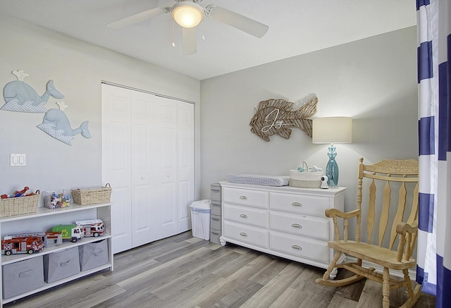 interior space with light hardwood / wood-style floors, a closet, and ceiling fan