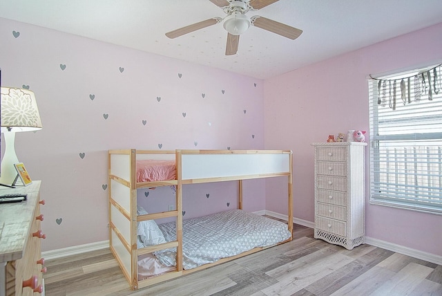 unfurnished bedroom featuring ceiling fan and wood-type flooring