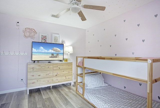 bedroom featuring ceiling fan and hardwood / wood-style flooring