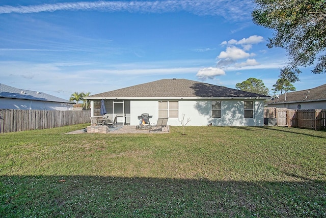 back of house with a patio and a yard