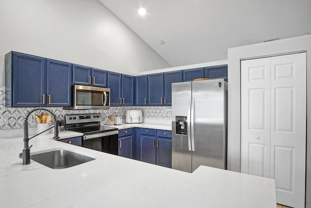 kitchen featuring appliances with stainless steel finishes, sink, blue cabinetry, high vaulted ceiling, and decorative backsplash