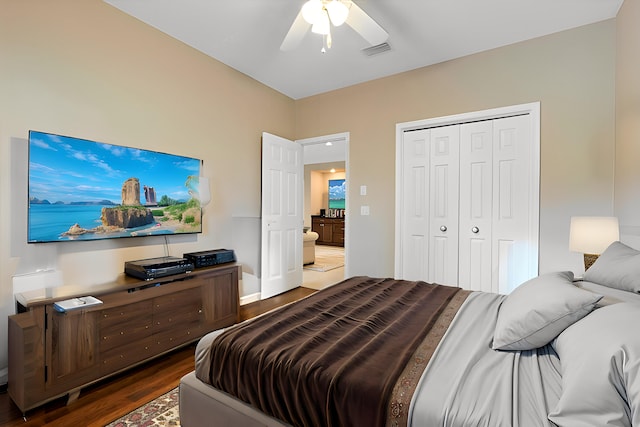 bedroom with a ceiling fan, a closet, visible vents, and wood finished floors