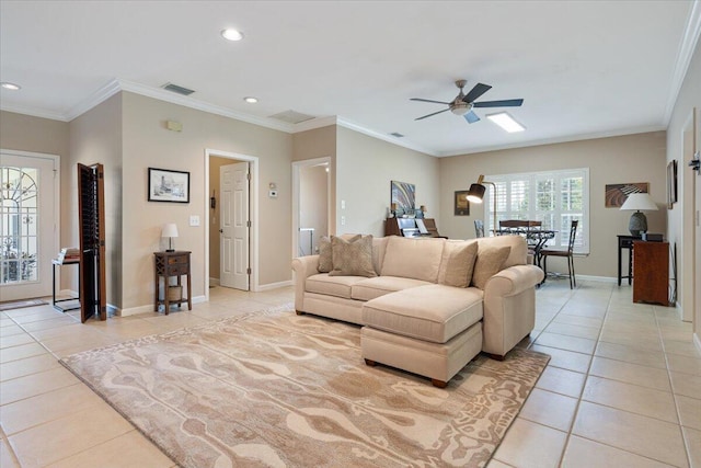 tiled living room with ornamental molding and ceiling fan