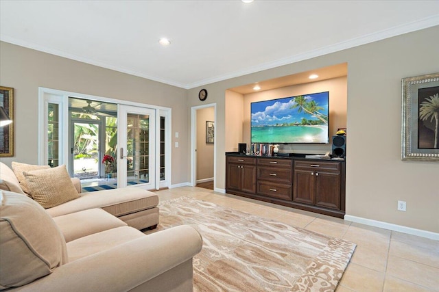 tiled living room with crown molding and french doors