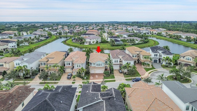 drone / aerial view with a water view