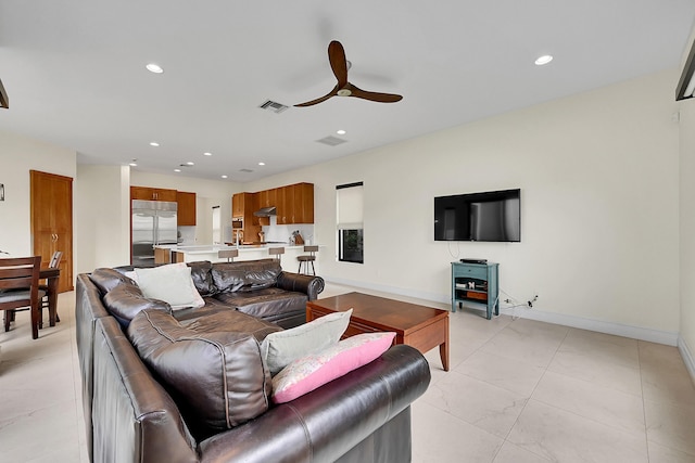 living room featuring ceiling fan