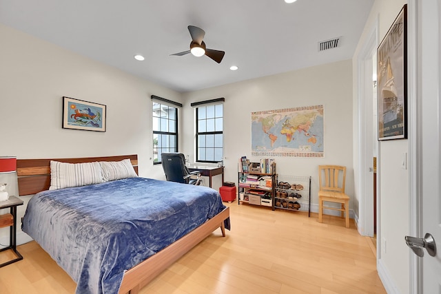 bedroom featuring ceiling fan and hardwood / wood-style floors