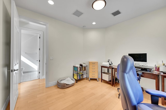 office space with light wood-type flooring