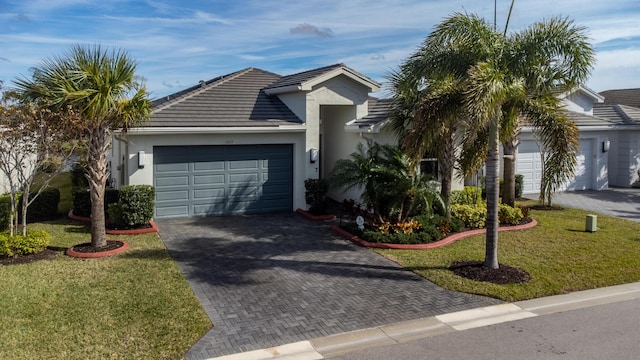 single story home with a garage and a front yard