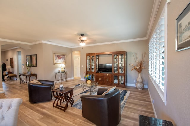 living room featuring ceiling fan, crown molding, and wood-type flooring