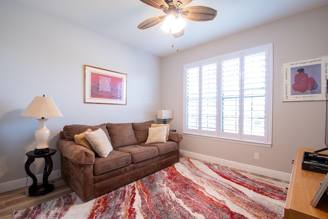 living room with hardwood / wood-style floors and ceiling fan