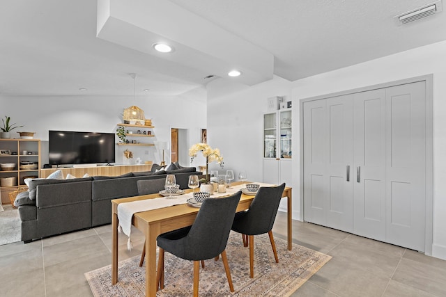 dining space featuring recessed lighting, visible vents, vaulted ceiling, and light tile patterned flooring