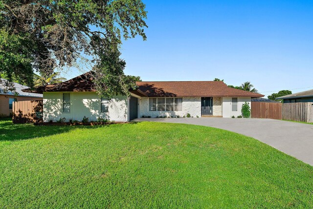 ranch-style house featuring a garage