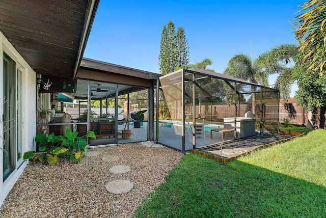 view of yard featuring a fenced in pool, a patio area, a lanai, and a fenced backyard