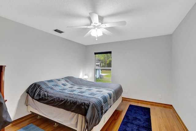 bedroom featuring ceiling fan and hardwood / wood-style floors