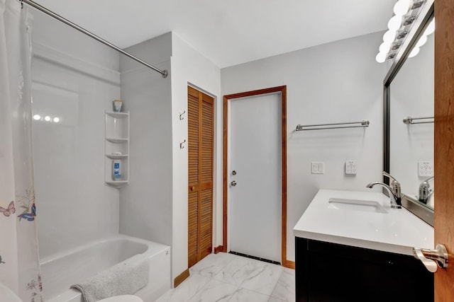 bathroom with vanity and  shower combination