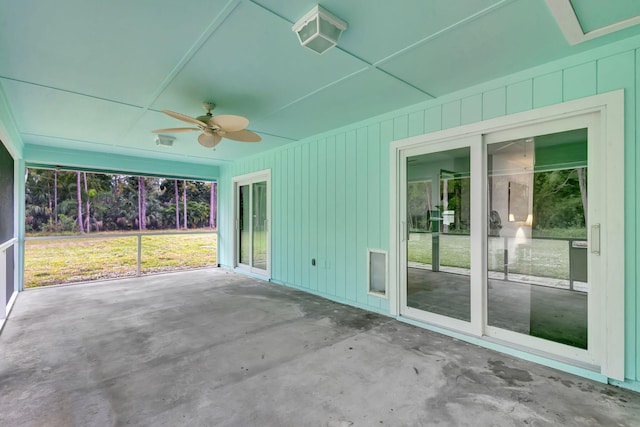 exterior space featuring ceiling fan