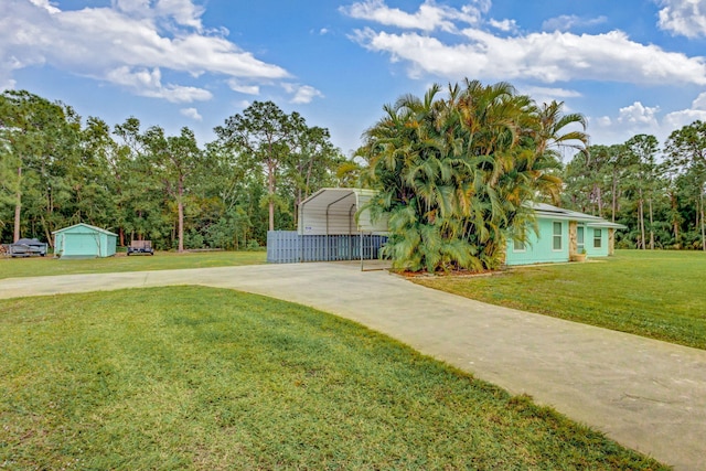 single story home with a front yard and a carport