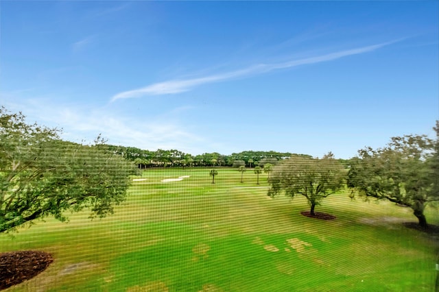 view of home's community with a lawn