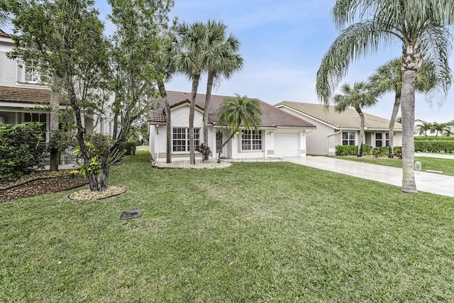 view of front of house with a garage and a front yard