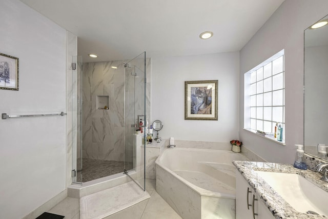 bathroom featuring vanity, independent shower and bath, and tile patterned floors