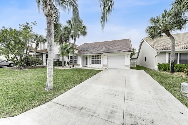 ranch-style house with a garage and a front lawn