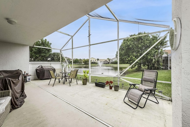 view of patio with a water view and grilling area