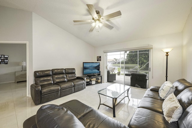 living room featuring ceiling fan, light tile patterned flooring, a textured ceiling, and lofted ceiling