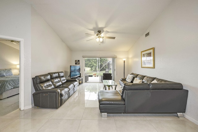 living room featuring light tile patterned flooring, vaulted ceiling, and ceiling fan