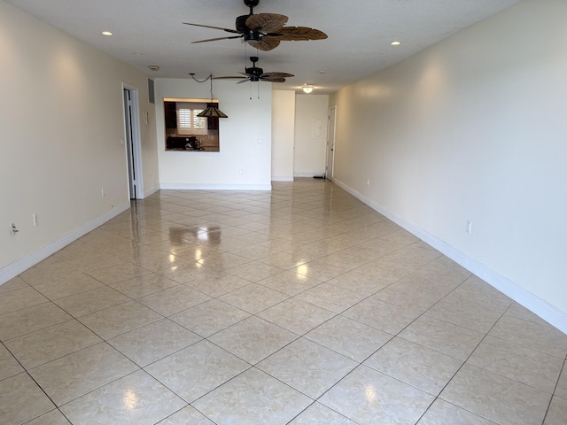 spare room featuring ceiling fan