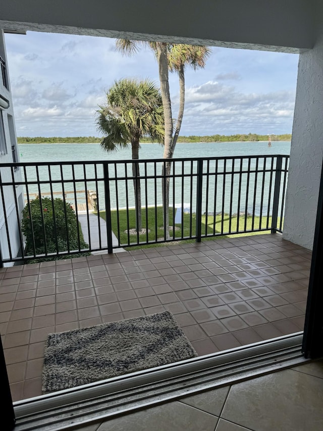 balcony featuring a water view