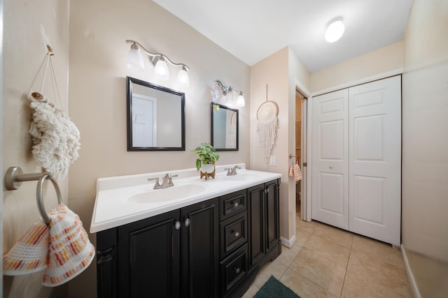 bathroom with tile patterned floors and vanity