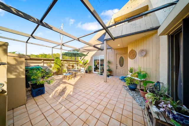 view of patio / terrace featuring a lanai