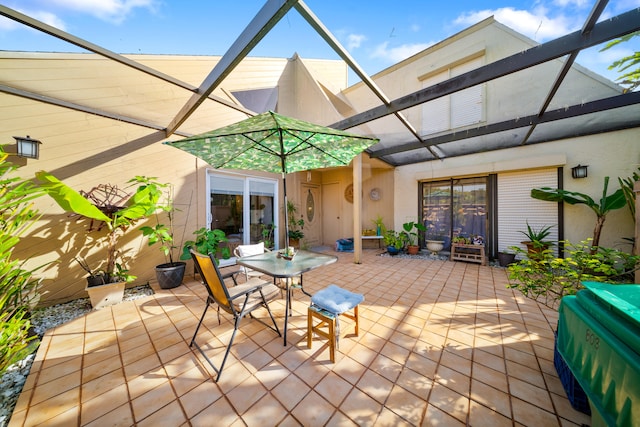 view of patio / terrace featuring glass enclosure