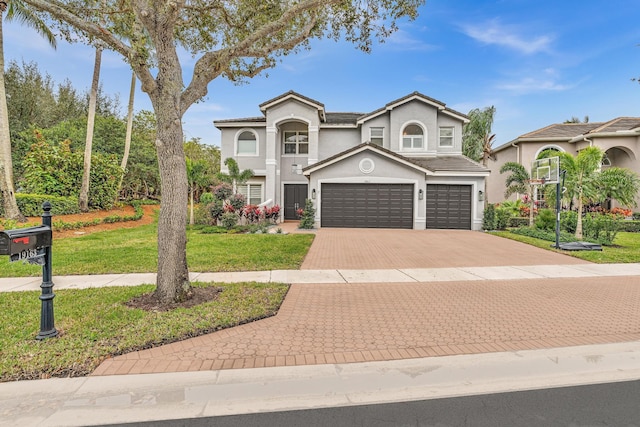 view of front of home with a garage and a front yard