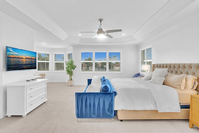 carpeted bedroom featuring multiple windows, ornamental molding, a raised ceiling, and ceiling fan