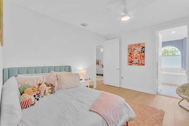 bedroom with hardwood / wood-style flooring and ceiling fan