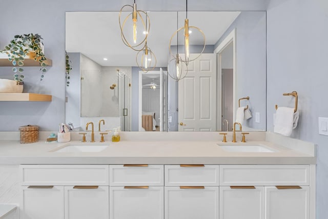 bathroom featuring vanity and an enclosed shower