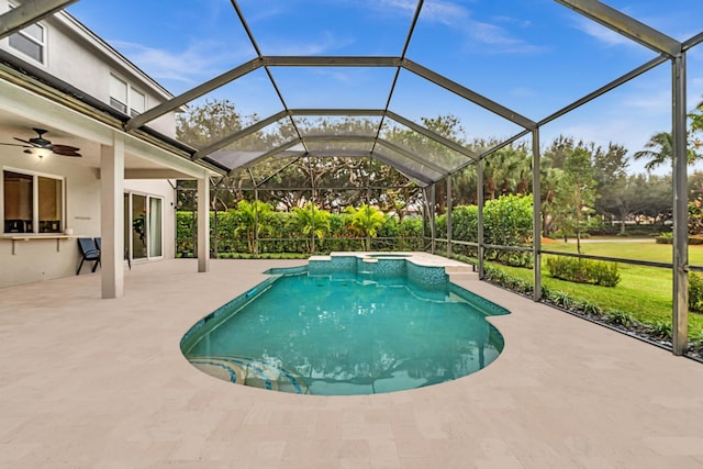 view of swimming pool featuring a lanai, a patio area, and ceiling fan