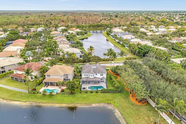 birds eye view of property with a water view