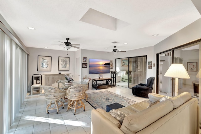 tiled living room featuring ceiling fan