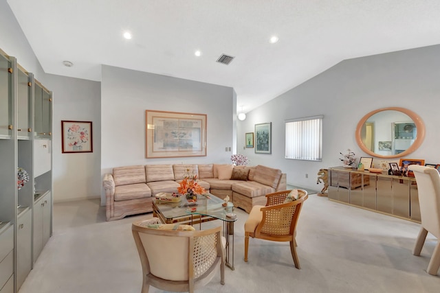 carpeted living room with lofted ceiling