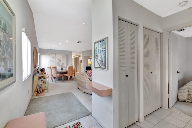 hall featuring light tile patterned flooring