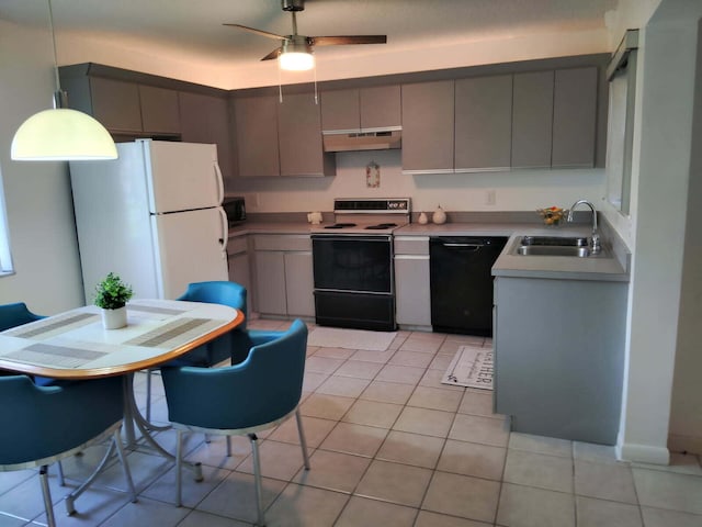 2430 NW 12th St, Delray Beach, FL 33445 - kitchen with black appliances, a sink, under cabinet range hood, and gray cabinetry