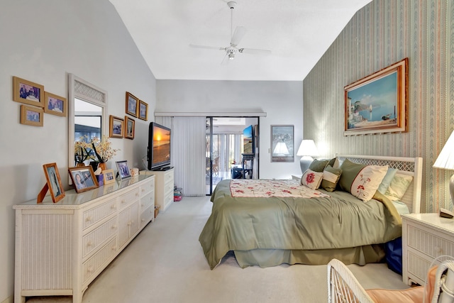 carpeted bedroom with vaulted ceiling, access to outside, and ceiling fan