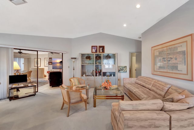 carpeted living room with vaulted ceiling and ceiling fan